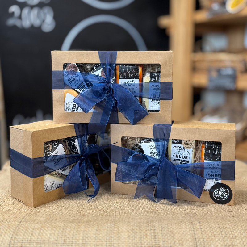 three gift hamper boxes stacked